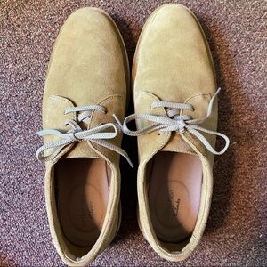 Quality Clarks sand colored suede shoes for ultimate comfort and timeless style.